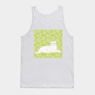 The cute and alert white cat is waiting and watching you in a fresh spring green meadow Tank Top